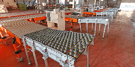 Rows of expandable flexible conveyors lined up on a warehouse floor