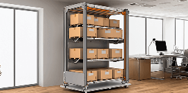A mobile shelving unit on wheels holds packages in an open office setting with desktop work station in the background